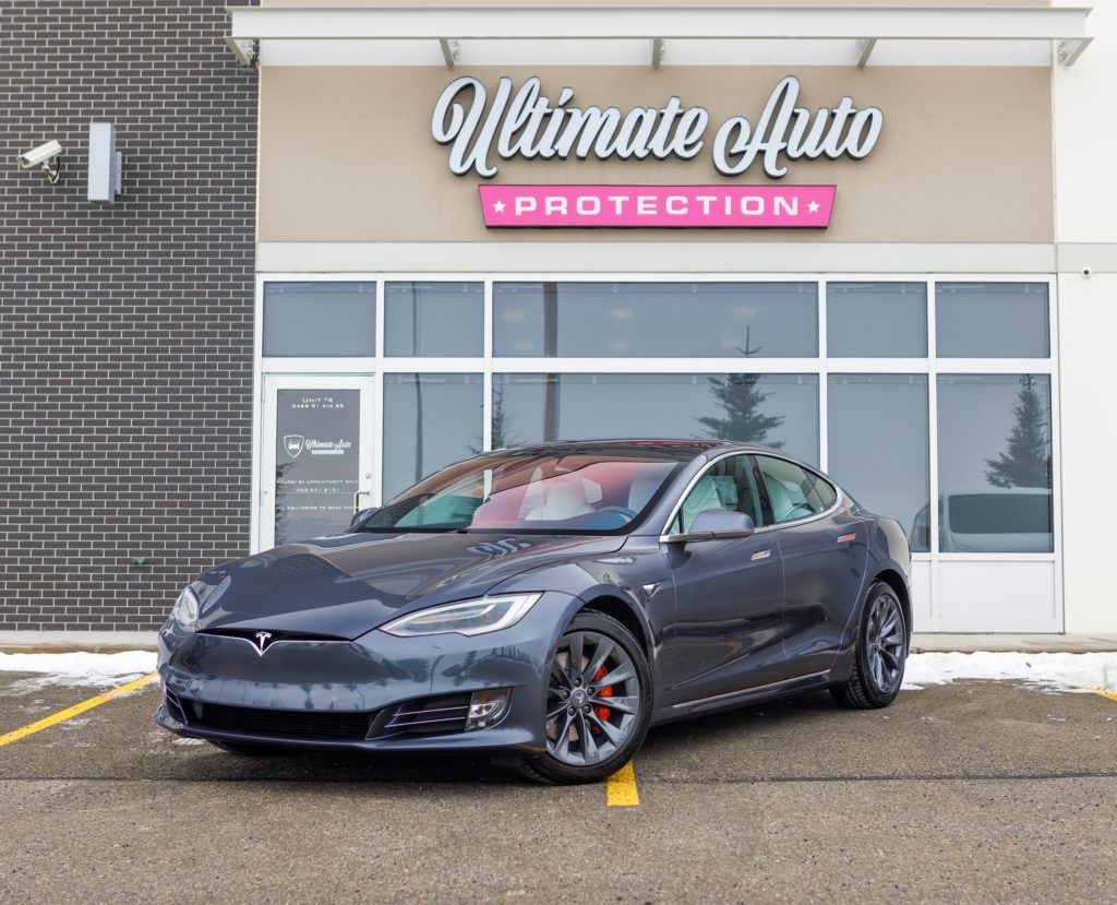 gray tesla outside of ultimate auto protection